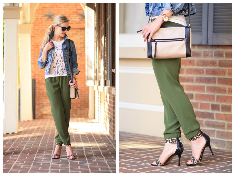 LOFT leopard print ankle strap heels, Kate Spade black and tan colorblock  bag, cropped denim jacket, graphic tee, olive track pant with tapered leg,  track pants with heels - Meagan's Moda