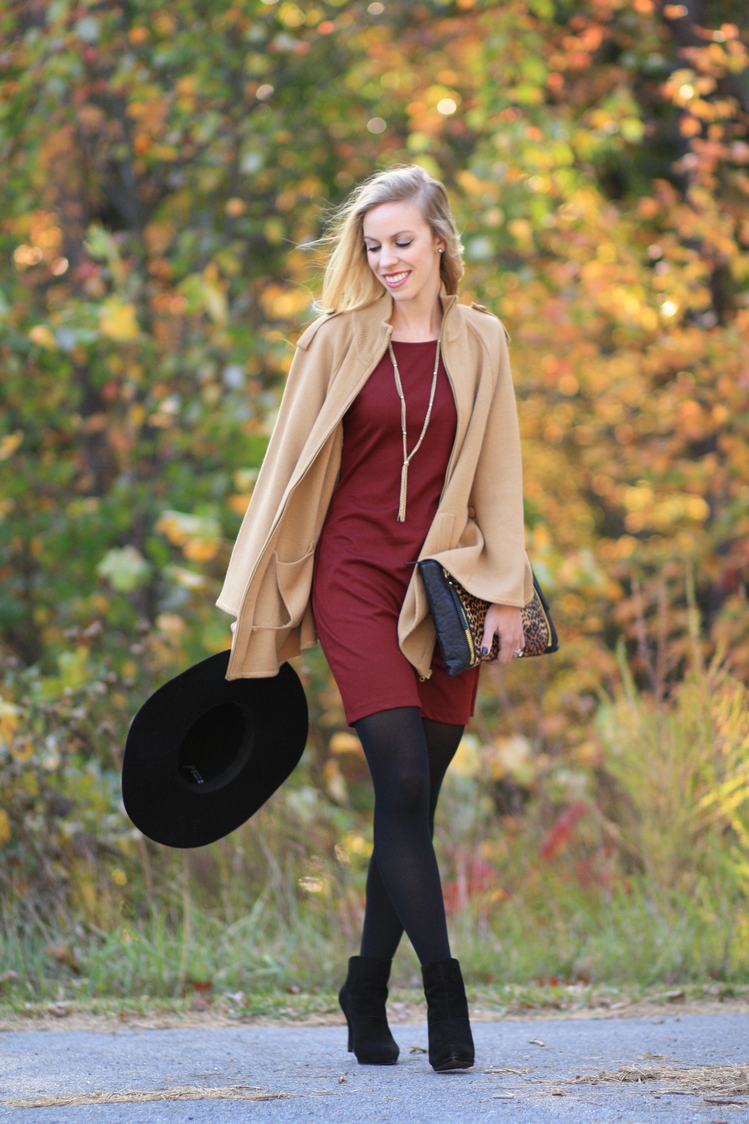 camel cape, burgundy shift dress, black tights, black suede ankle