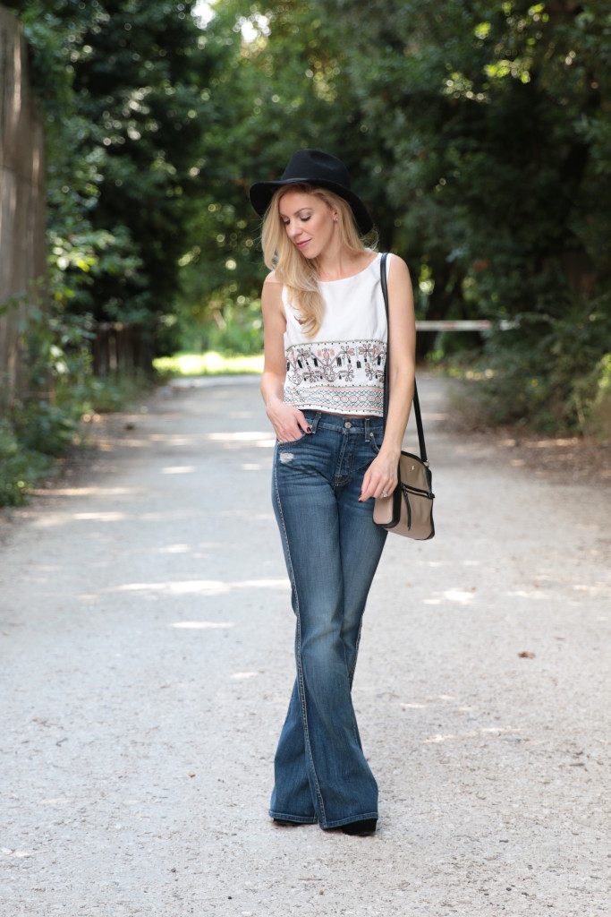 7 for all mankind high waist vintage bootcut jeans, 1970s Louis Vuitton  Passy bag, Zara gray suede fringe top, how to wear flare jeans, 70s style  outfit with fringe and flared denim 