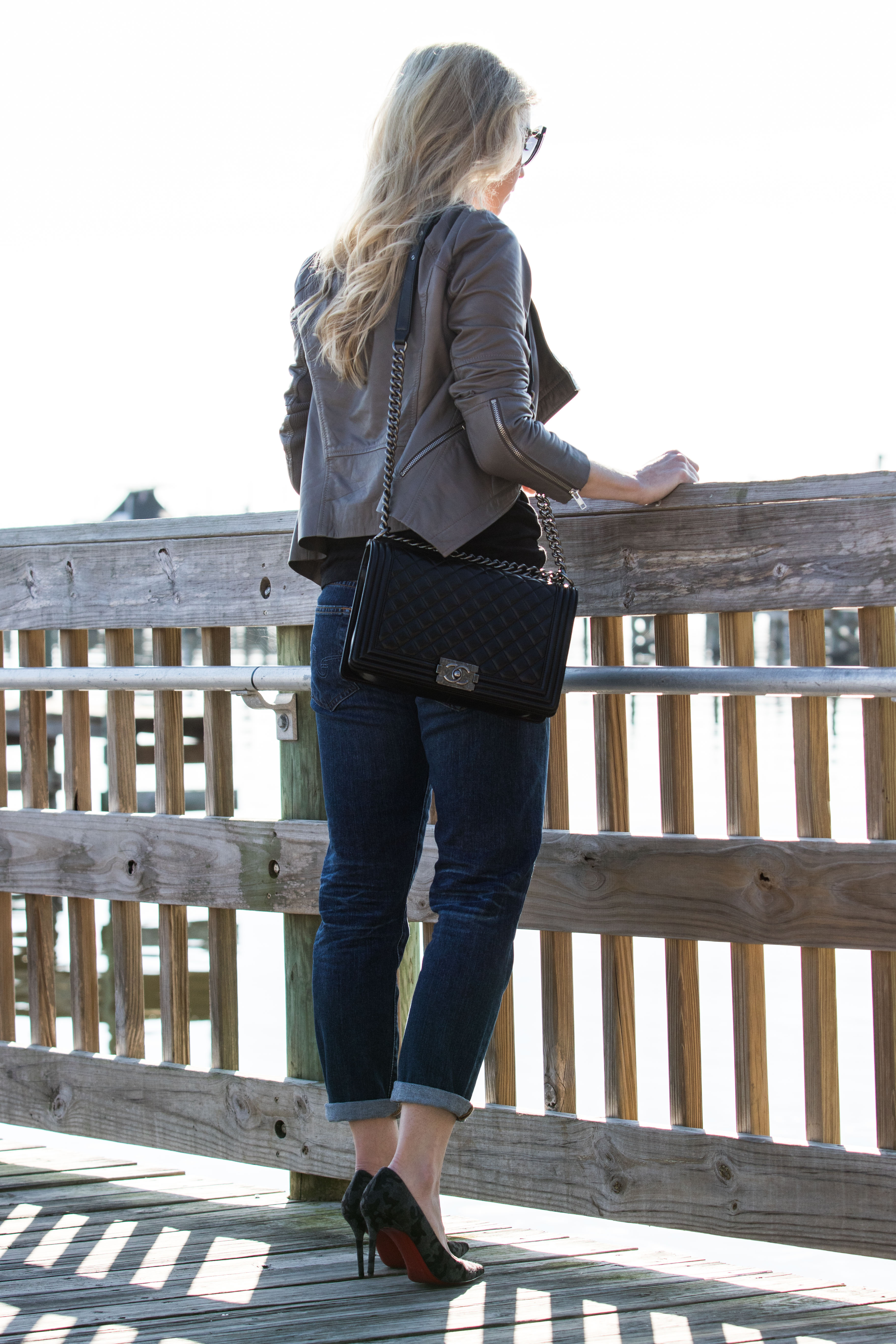 Meagan Brandon gray leather jacket with Chanel boy bag and