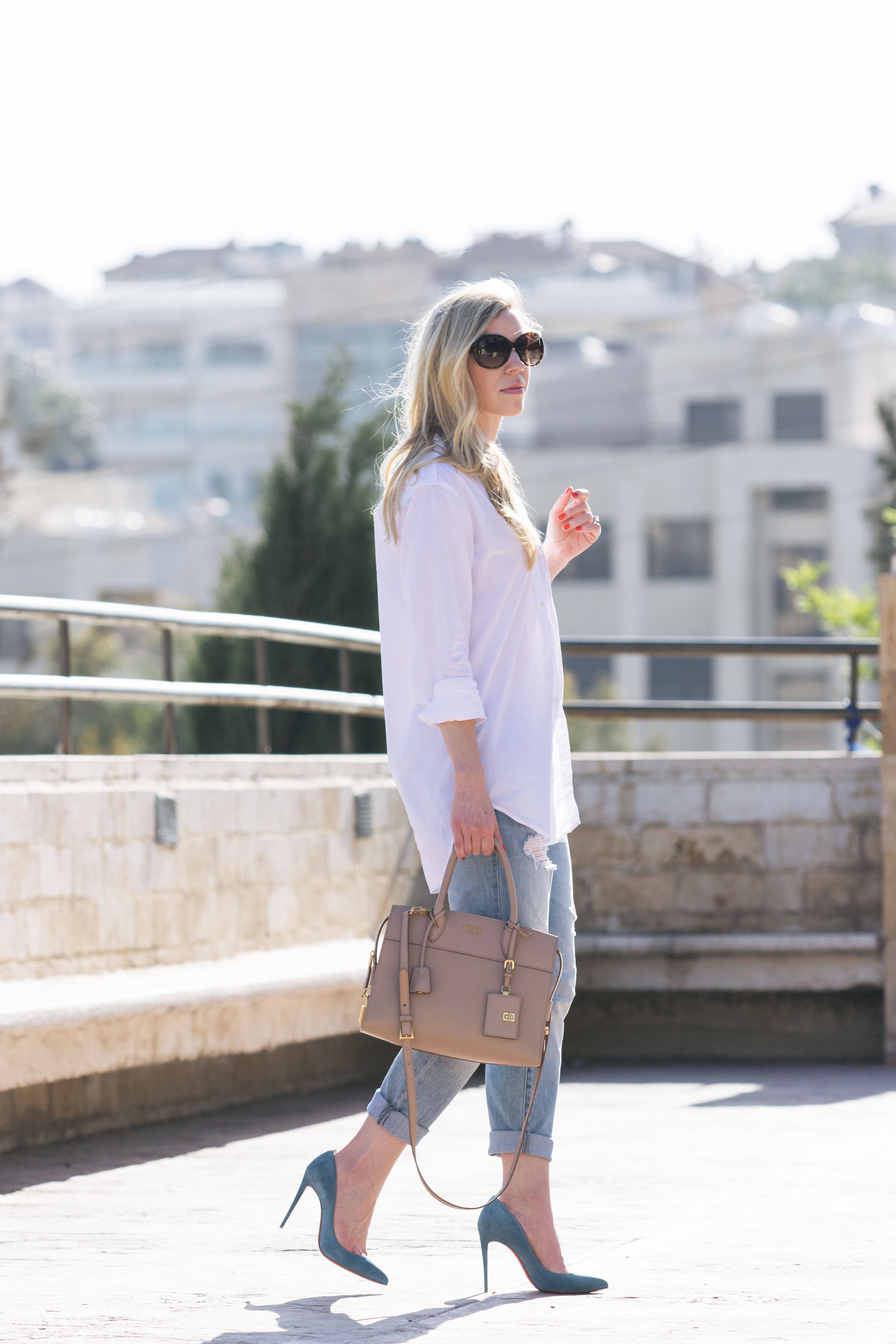 Meagan Brandon fashion blogger shows how dress up white button down with  Christian Louboutin pumps and Prada bag - Meagan's Moda