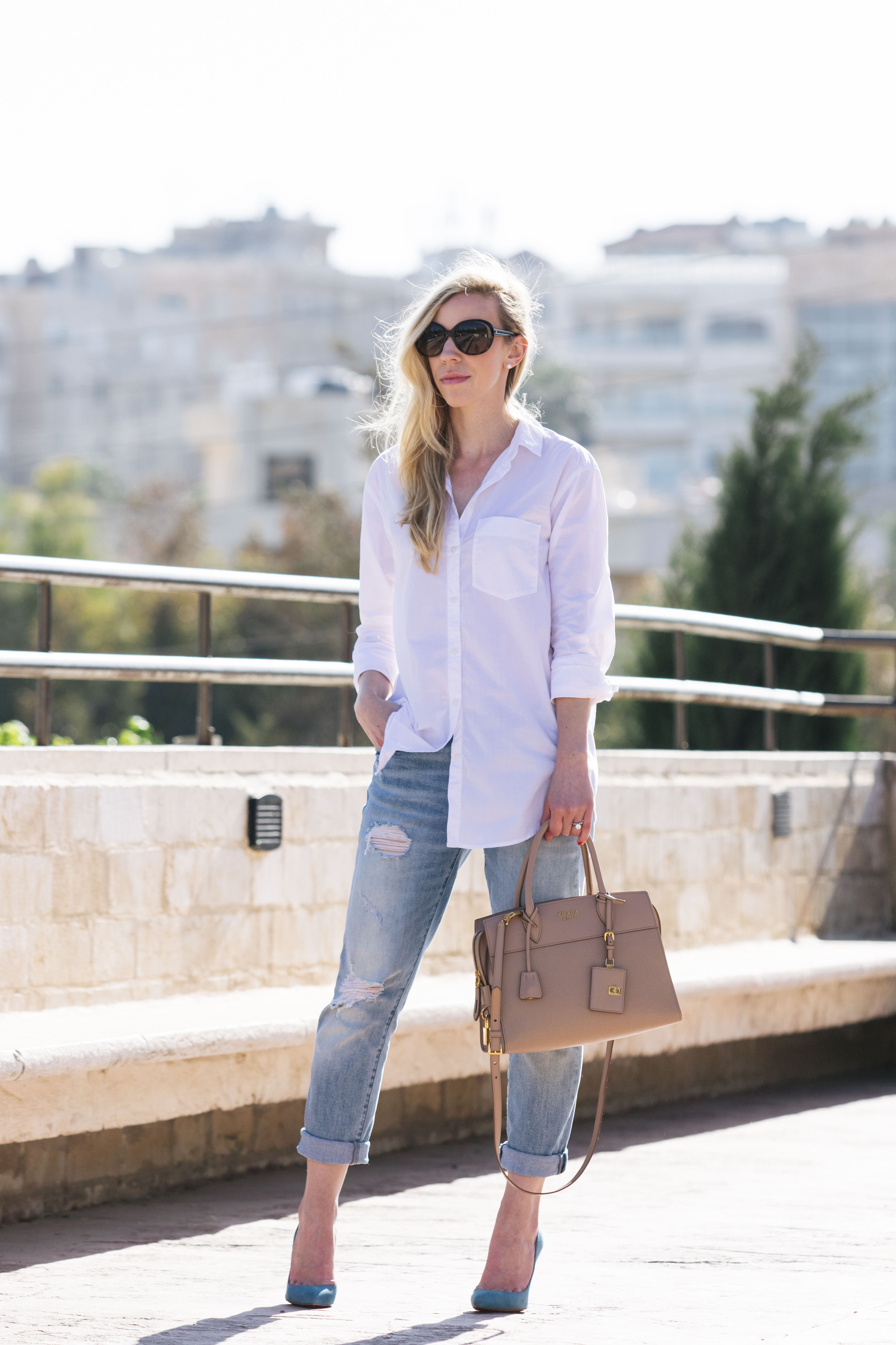 Meagan Brandon fashion blogger shows how dress up white button down with  Christian Louboutin pumps and Prada bag - Meagan's Moda
