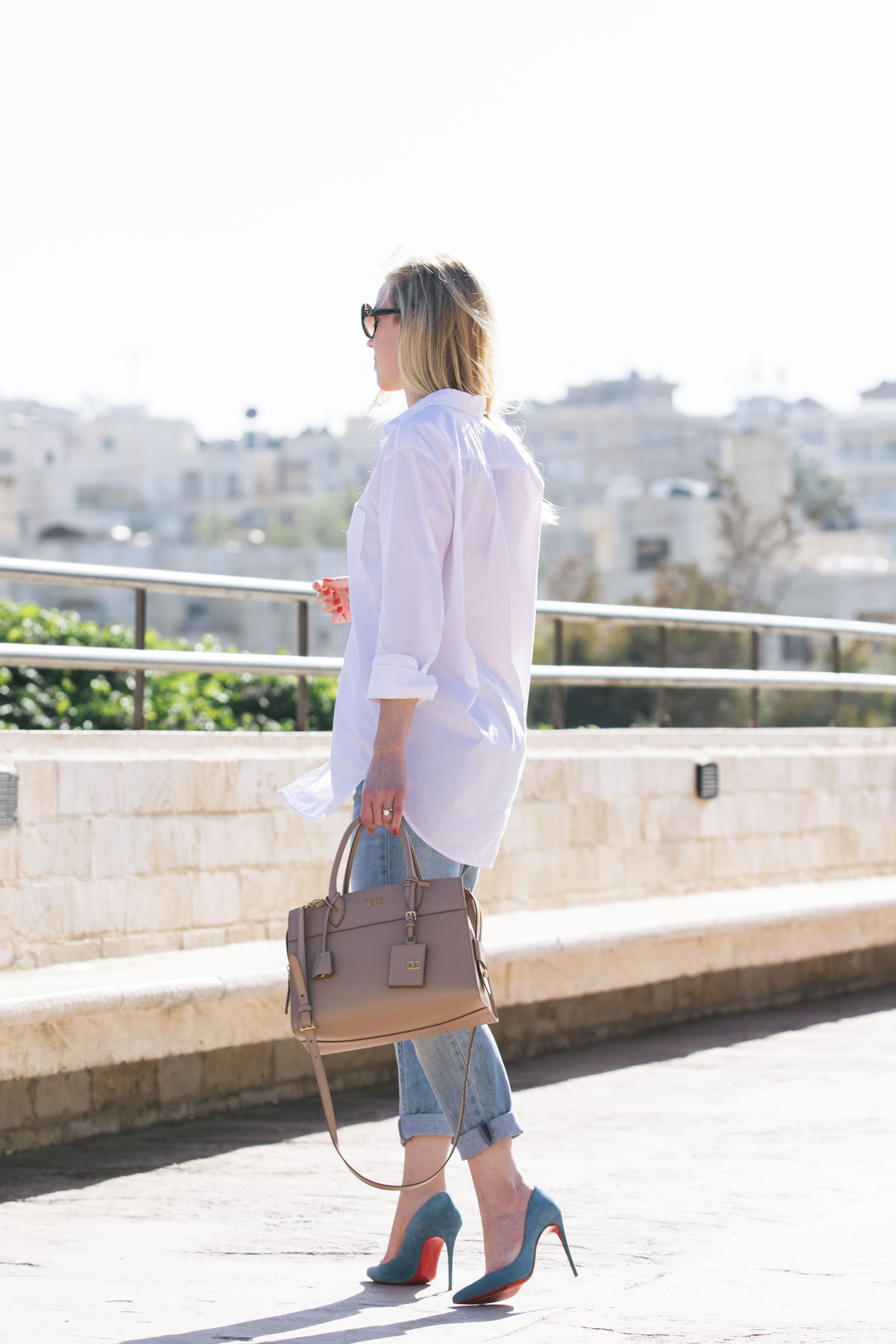 Meagan Brandon fashion blogger shows how dress up white button down with  Christian Louboutin pumps and Prada bag - Meagan's Moda