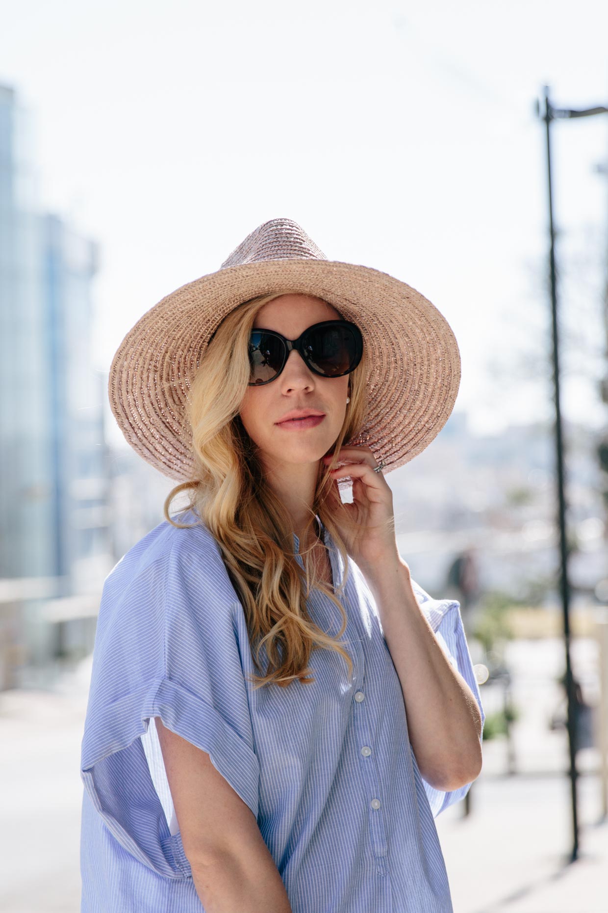 Meagan Brandon fashion blogger wearing Brixton Joanna hat champagne, straw  panama hat with striped tunic shirt summer outfit - Meagan's Moda