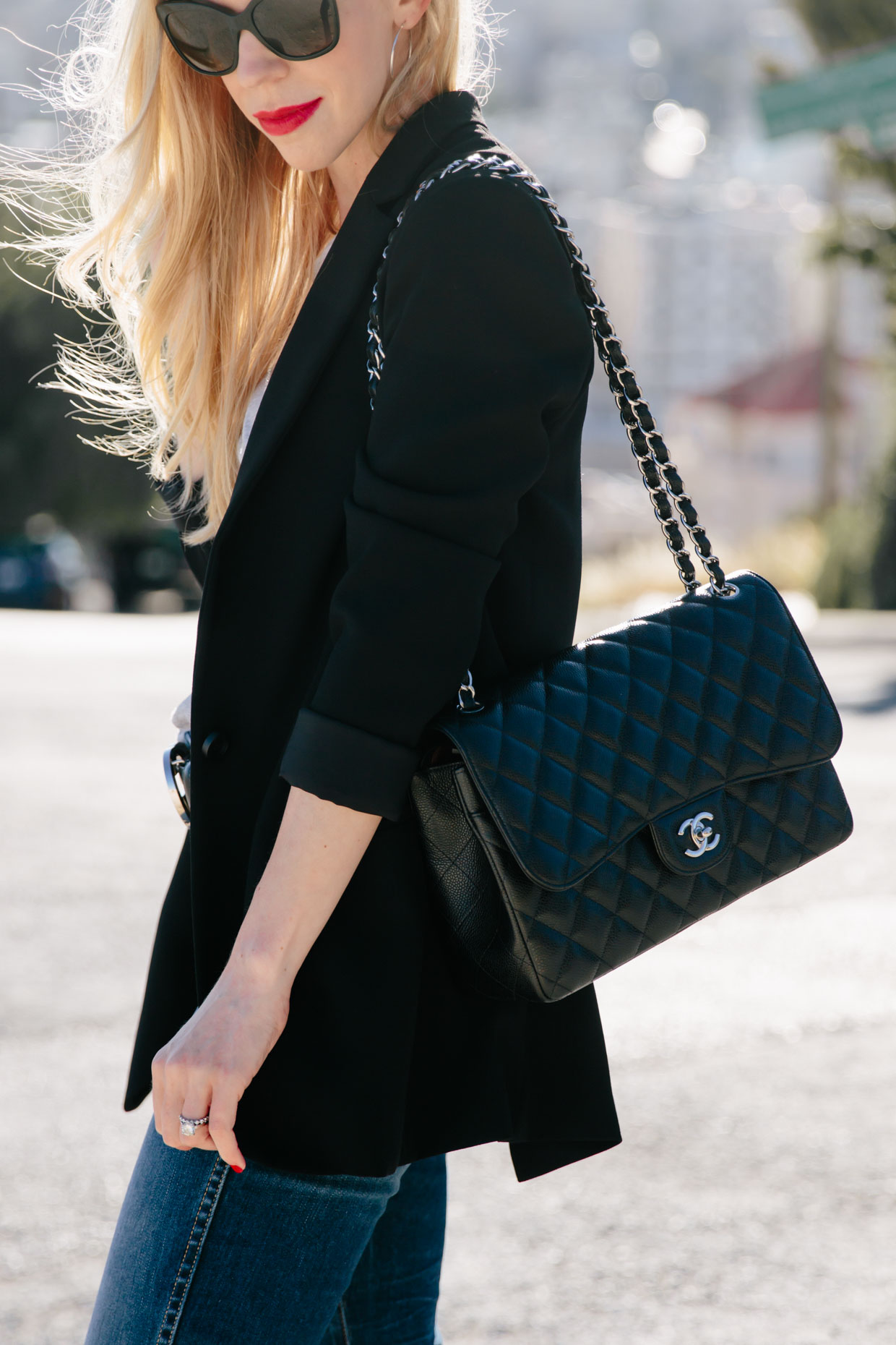 black blazer outfit with red lip and Chanel Jumbo bag, Clinique