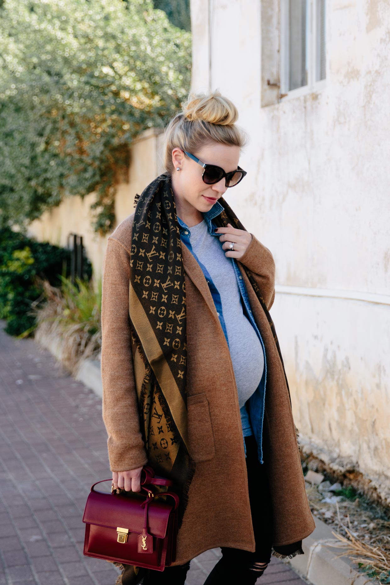 Meagan Brandon fashion blogger of Meagan's Moda wears layered fall  maternity outfit with Madewell camel sweater coat, Louis Vuitton brown  shiny monogram shawl scarf and denim shirt - Meagan's Moda