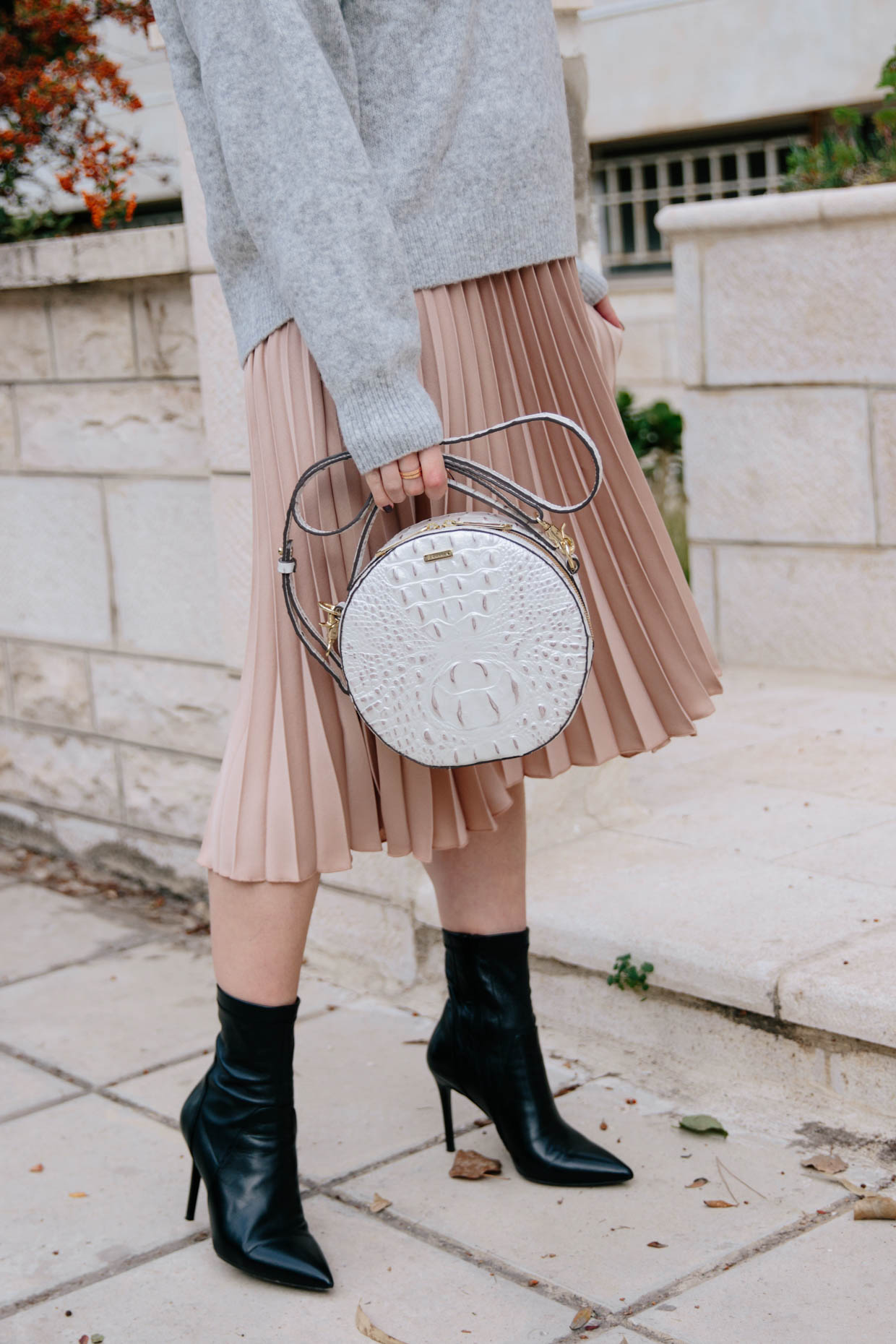 How to wear a pleated midi skirt with sock boots, oversized