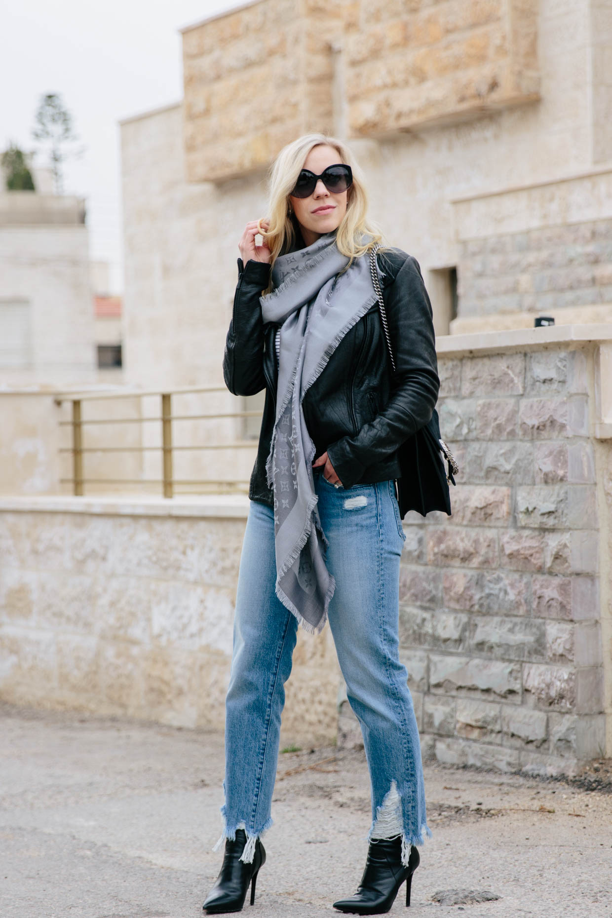 Meagan Brandon fashion blogger of Meagan's Moda shows how to wear a Louis  Vuitton oversized shawl scarf with leather jacket and high waist skinny  jeans - Meagan's Moda