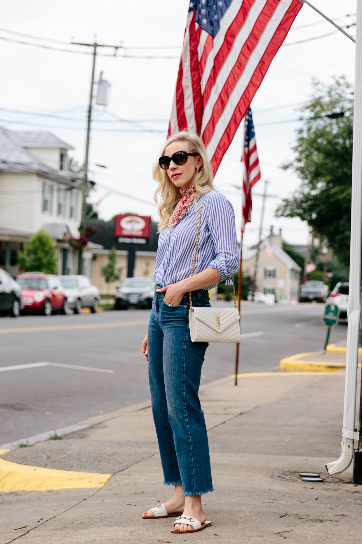 Meagan Brandon fashion blogger of Meagan's Moda wears blue and white  striped shirt with olive paperbag waist shorts and Gucci bag - Meagan's Moda