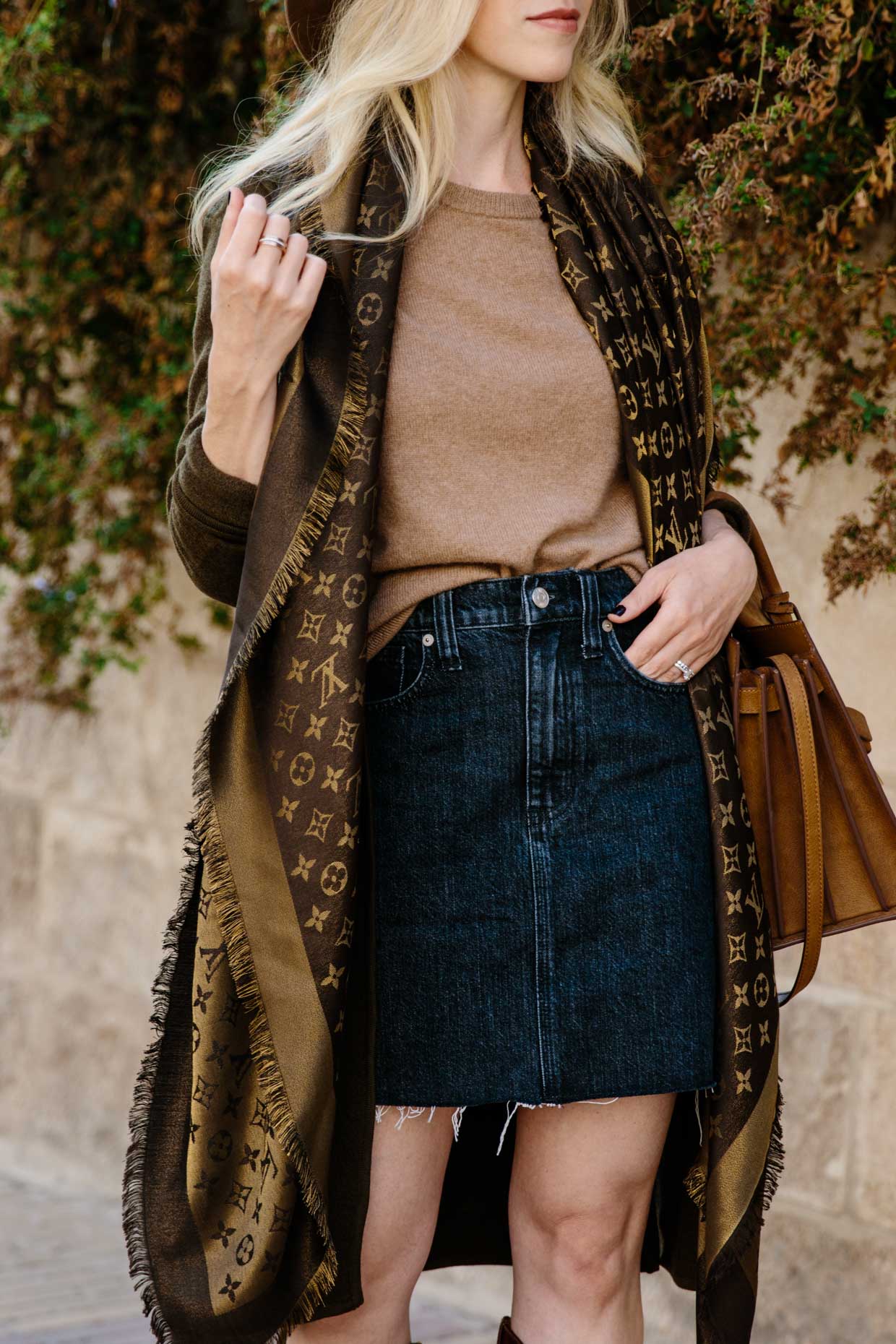 Chic layered fall outfit idea with camel sweater, black denim