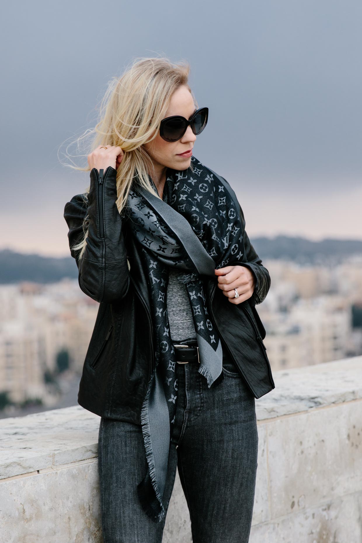 Meagan Brandon fashion blogger of Meagan's Moda wears black leather jacket  with striped tee, gray Louis Vuitton scarf and Gucci belt, outfit idea with Louis  Vuitton monogram shine shawl - Meagan's Moda