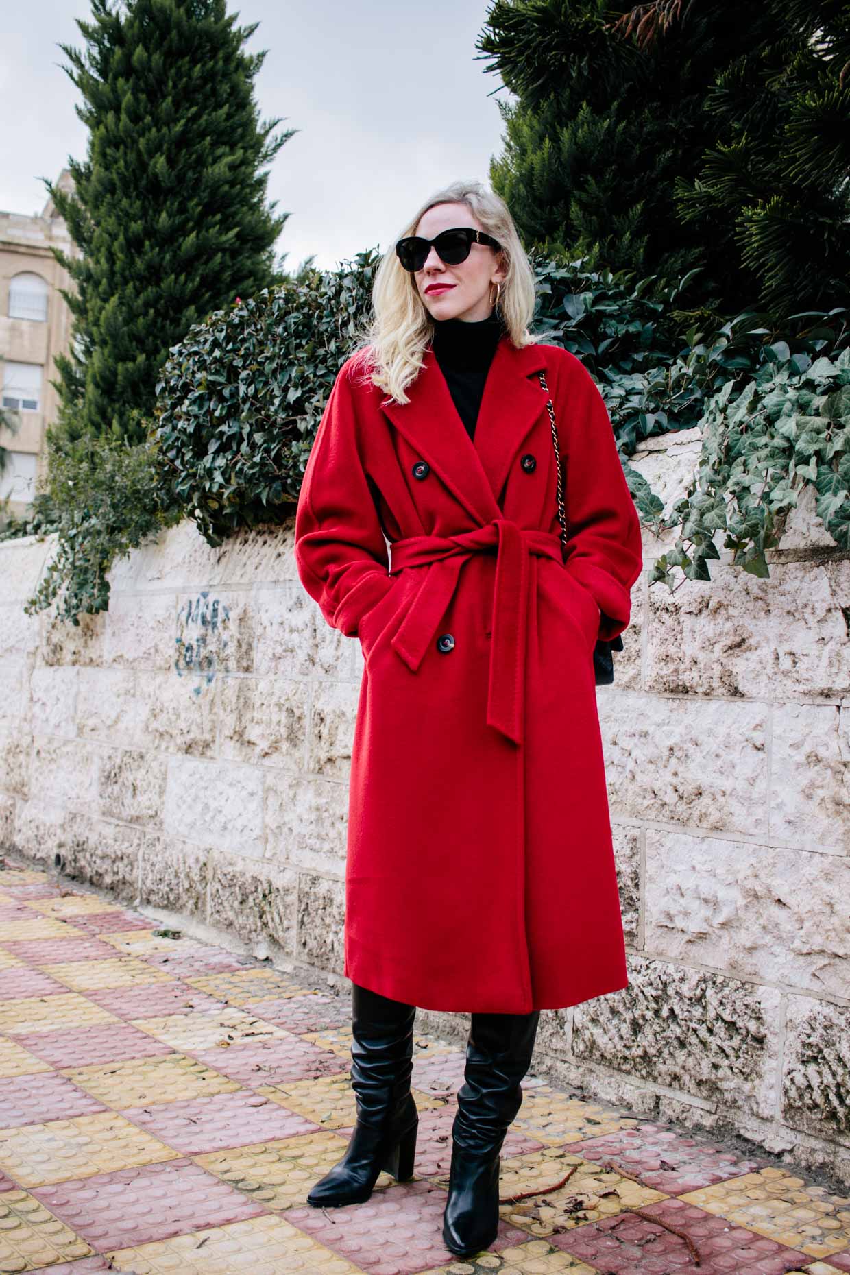 Meagan Brandon fashion blogger of Meagan's Moda wears Max Mara Madame red coat with slouchy leather boots