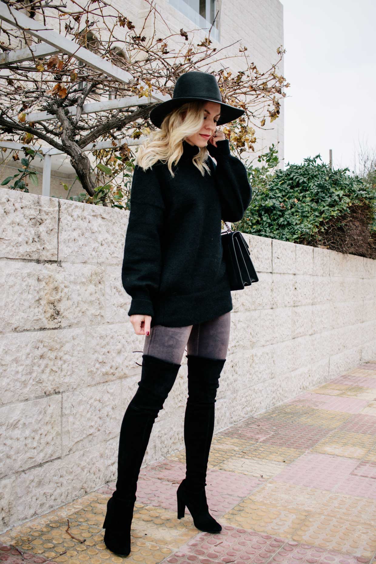 Meagan Brandon fashion blogger of Meagan's Moda wears Spanx velvet leggings  with oversized sweater and over the knee boots - Meagan's Moda