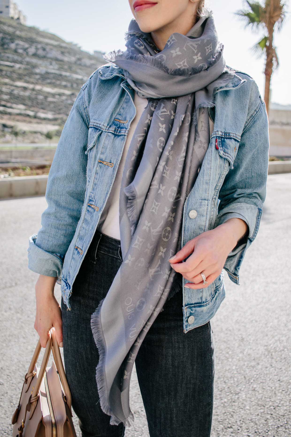 Meagan Brandon fashion blogger of Meagan's Moda styles Louis Vuitton  charcoal shine shawl scarf with Levi's denim jacket for casual spring  outfit - Meagan's Moda