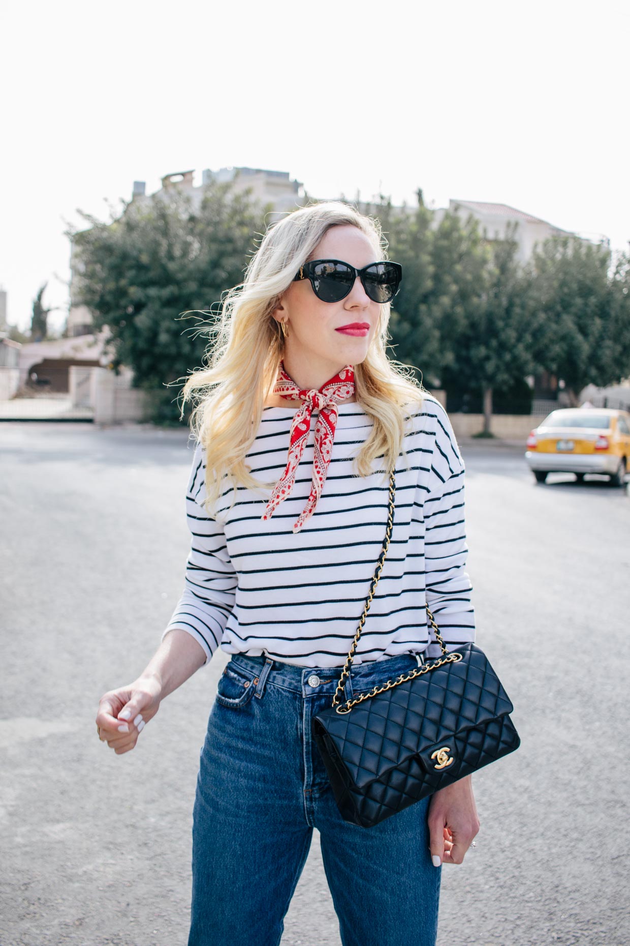 Meagan Brandon fashion blogger of Meagan's Moda styles a black and white  striped tee with red bandana neck scarf and Chanel classic flap bag black  and gold - Meagan's Moda