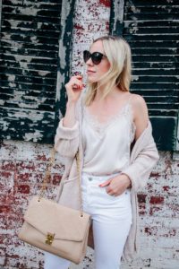 Meagan Brandon fashion blogger of Meagan's Moda styles beige lace trim camisole with white denim and beige cardigan