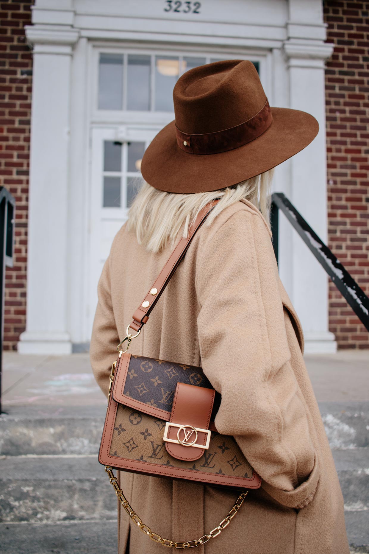 Meagan Brandon fashion blogger of Meagan's Moda wears Janessa Leone Harper  wool fedora with camel coat and Louis Vuitton Dauphine bag - Meagan's Moda