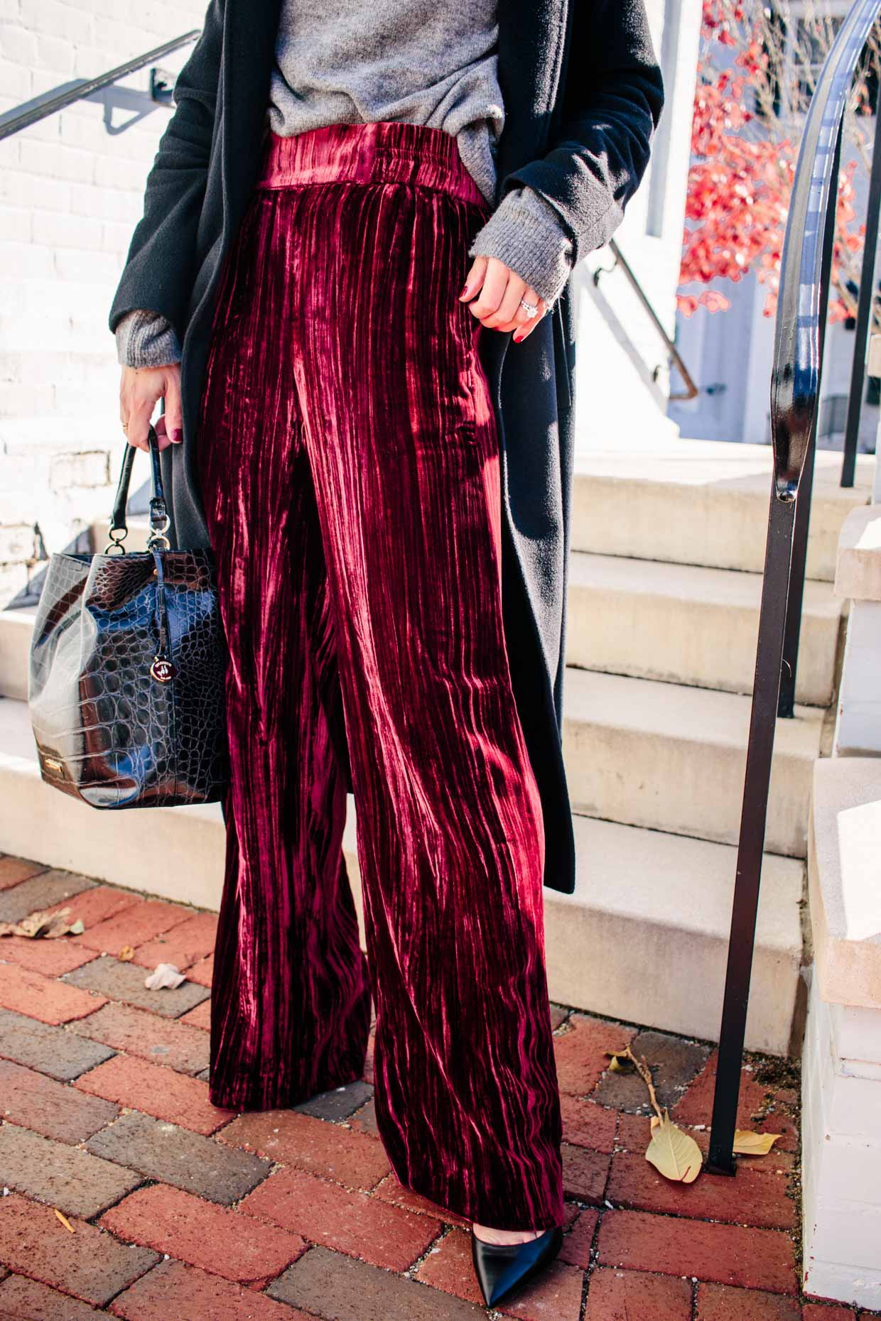 Meagan Brandon fashion blogger of Meagan's Moda shows how to wear red  velvet pants for the holidays with Valentino Rockstud pumps - Meagan's Moda