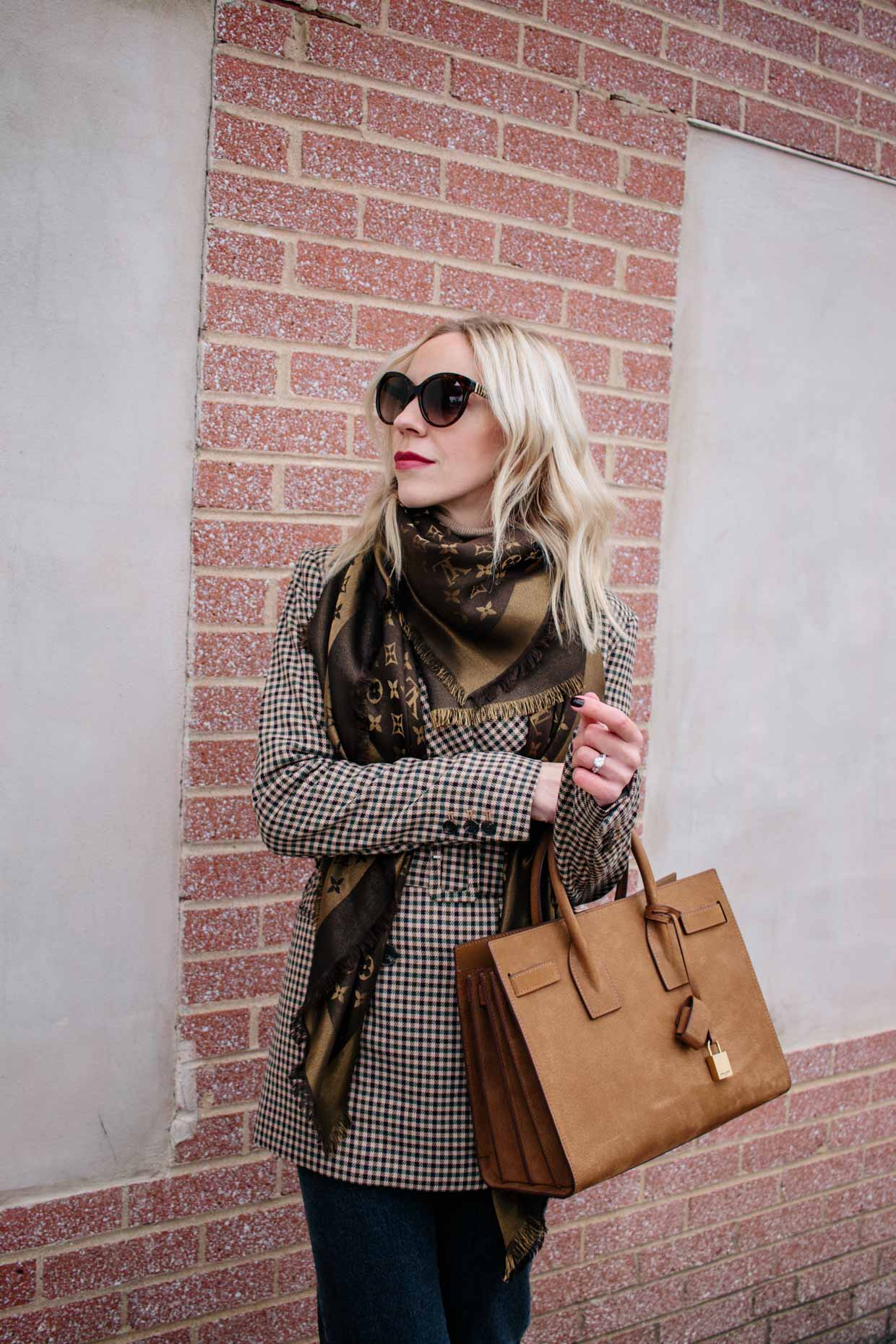 Meagan Brandon fashion blogger of Meagan's Moda wears Louis Vuitton brown  monogram shine shawl scarf with plaid blazer for chic fall outfit -  Meagan's Moda