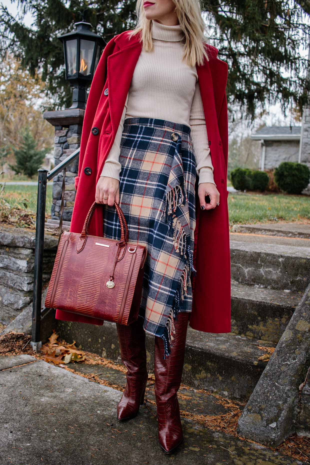 Meagan Brandon fashion blogger of Meagan's Moda wears rust colored poncho  with leather mini skirt, croc knee high boots and Louis Vuitton Dauphine -  Meagan's Moda