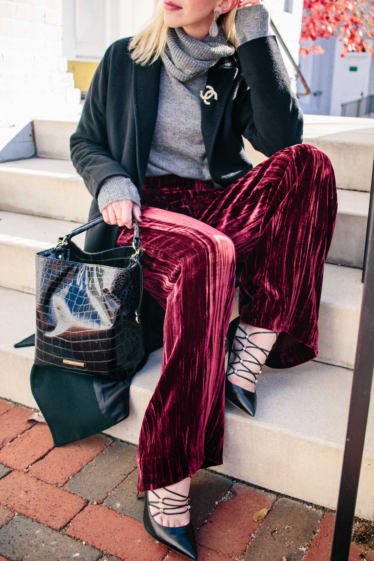 Meagan Brandon fashion blogger of Meagan's Moda wears red velvet pants for  holiday with gray sweater and Valentino rockstud pumps, how to wear velvet  pants - Meagan's Moda