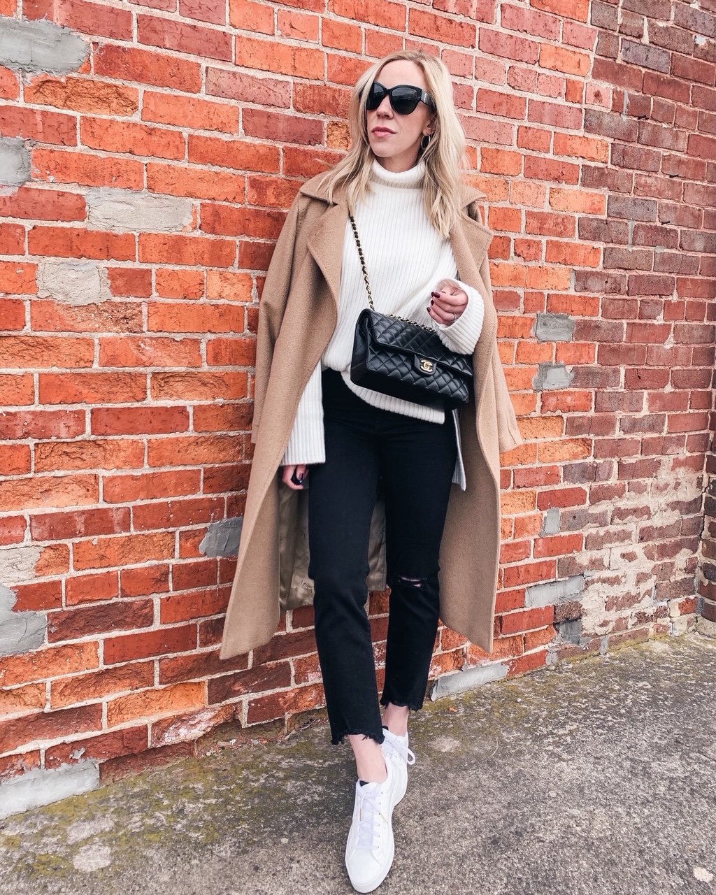 Patch Dissipate escort Meagan Brandon fashion blogger of Meagan's Moda wears camel coat with beige  turtleneck, black jeans and white Adidas sleek sneakers - Meagan's Moda