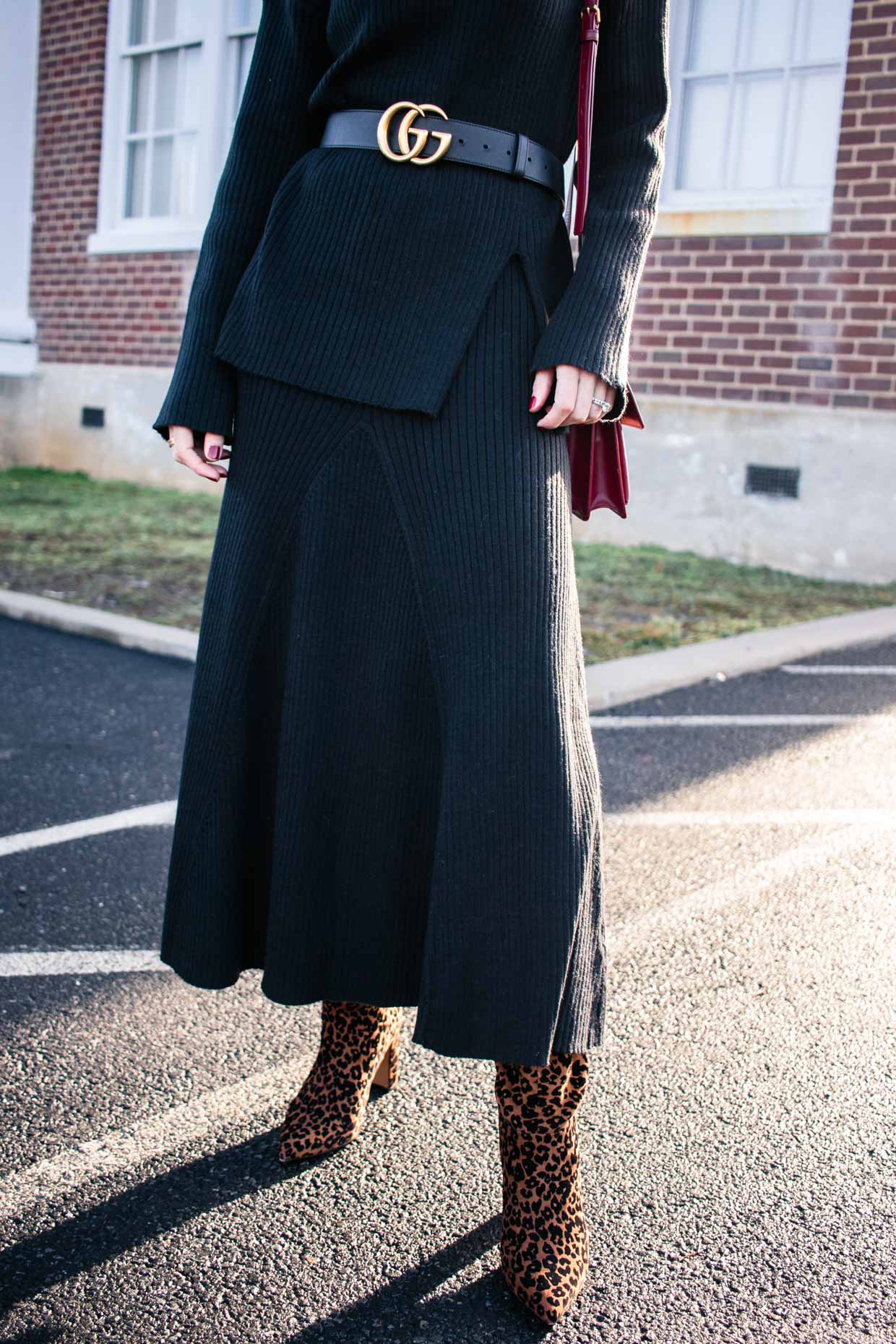 Meagan Brandon fashion blogger of Meagan's Moda wears H&M rust brown silk  shirt with leopard print pleated skirt, brown suede booties and Louis  Vuitton Dauphine bag for chic fall outfit - Meagan's