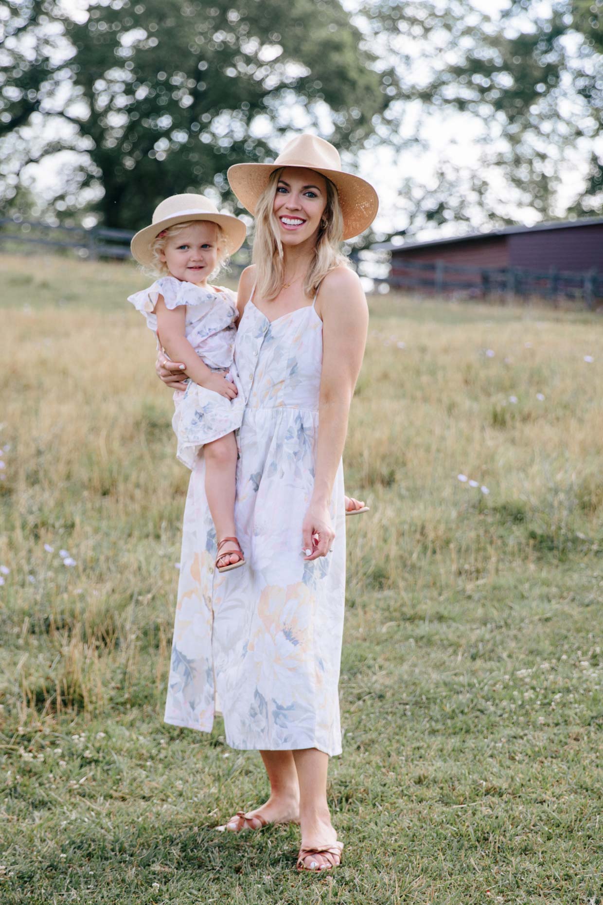 Meagan Brandon fashion blogger of Meagan's Moda wears H&M Mom and Mini floral print dresses with daughter