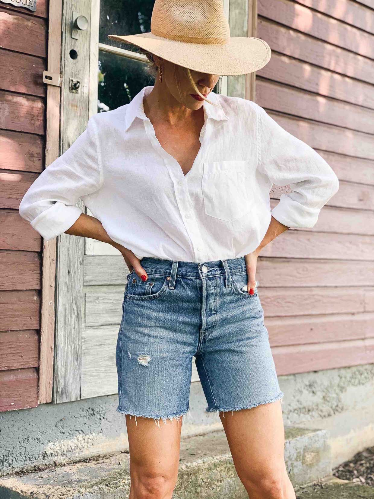 Meagan Brandon fashion blogger of Meagan's Moda wears Levi's mid length  denim shorts, how to wear mid length shorts - Meagan's Moda