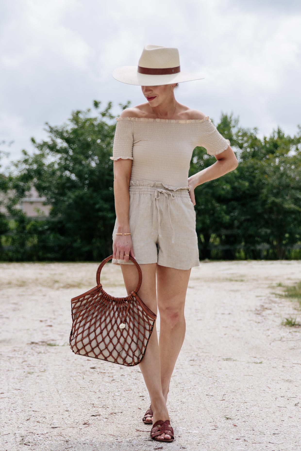 Meagan Brandon fashion blogger of Meagan's Moda wears beige monochrome outfit with off the shoulder top and high waist linen shorts