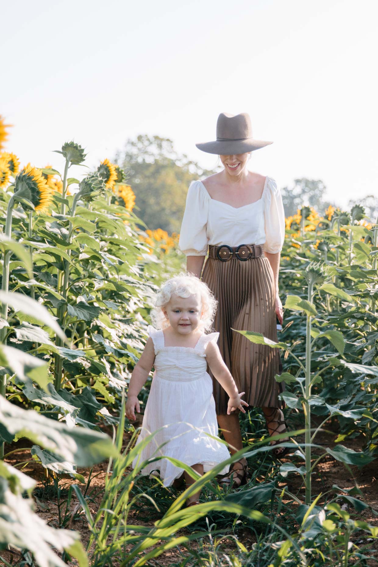 Meagan Brandon fashion blogger of Meagan's Moda sunflower field fashion shoot mommy and me outfits