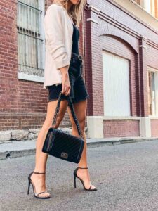 Meagan Brandon fashion blogger of Meagan's Moda shows how to wear mid length denim shorts stylish outfit