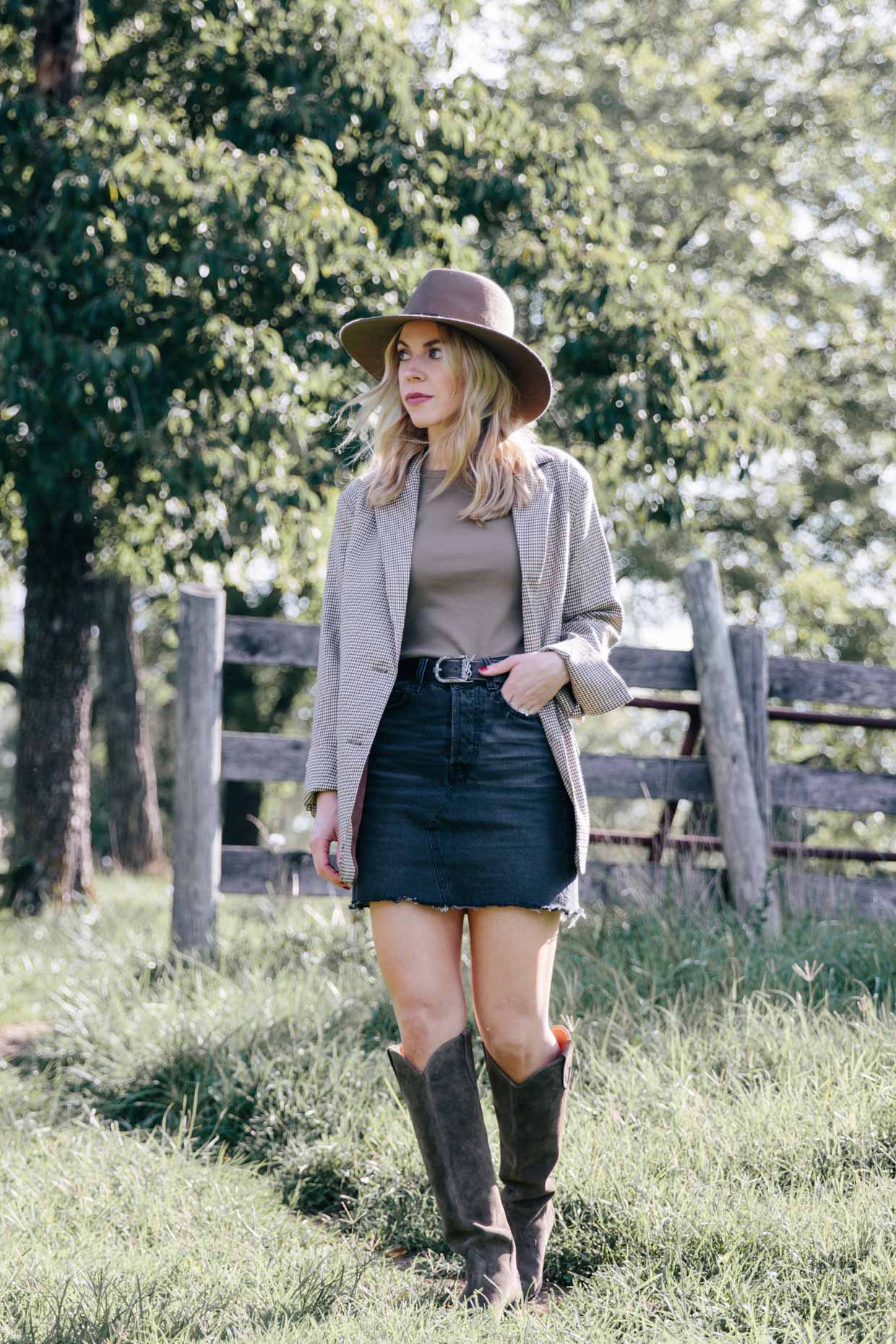 Meagan Brandon fashion blogger of Meagan's Moda wears Chicwish oversized blazer with mini skirt and tall western boots