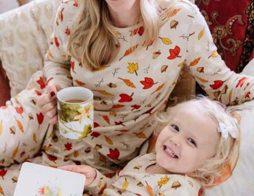 Meagan Brandon fashion blogger of Meagan's Moda wears leaf print matching family pajamas from Target with toddler