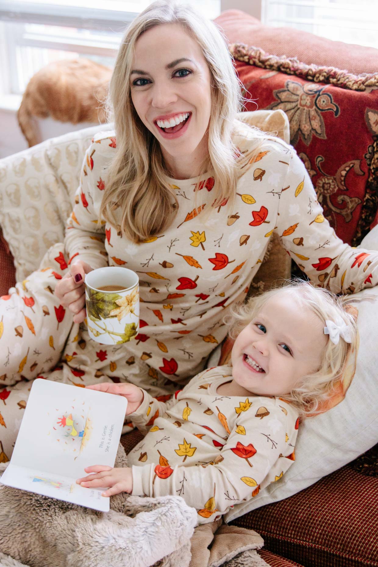 Meagan Brandon fashion blogger of Meagan's Moda wears leaf print matching family pajamas from Target with toddler