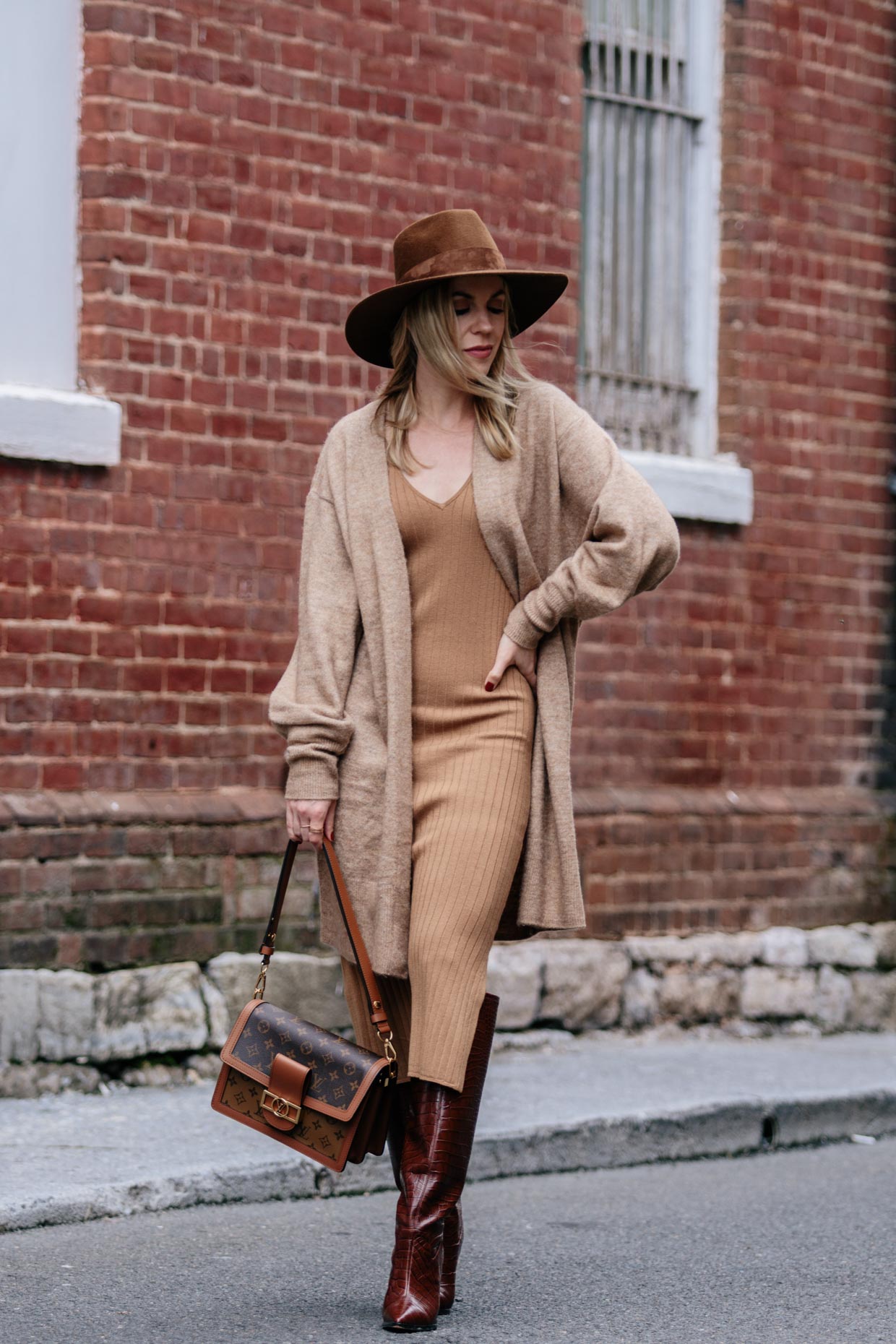 Meagan Brandon fashion blogger of Meagan's Moda wears camel poncho with  faux leather mini skirt, croc leather knee high boots and Louis Vuitton  Dauphine MM - Meagan's Moda