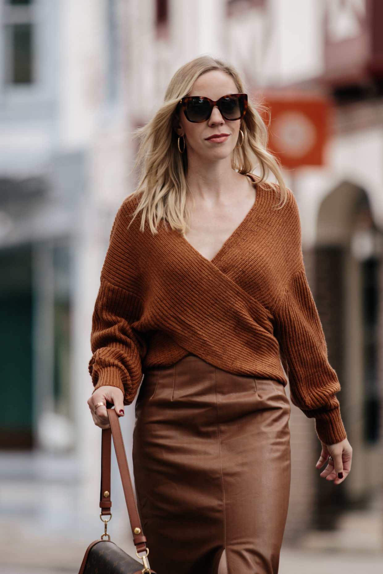 Chic layered fall outfit idea with camel sweater, black denim skirt and  Louis Vuitton brown monogram shine shawl scarf - Meagan's Moda