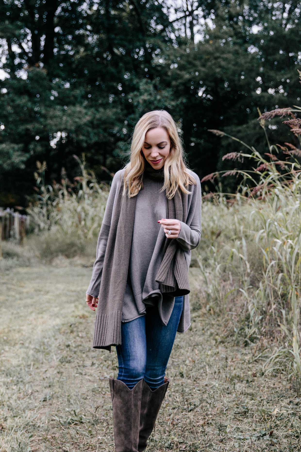 Meagan Brandon fashion blogger of Meagan's Moda wears State Cashmere oversized sweater with olive green scarf and western boots