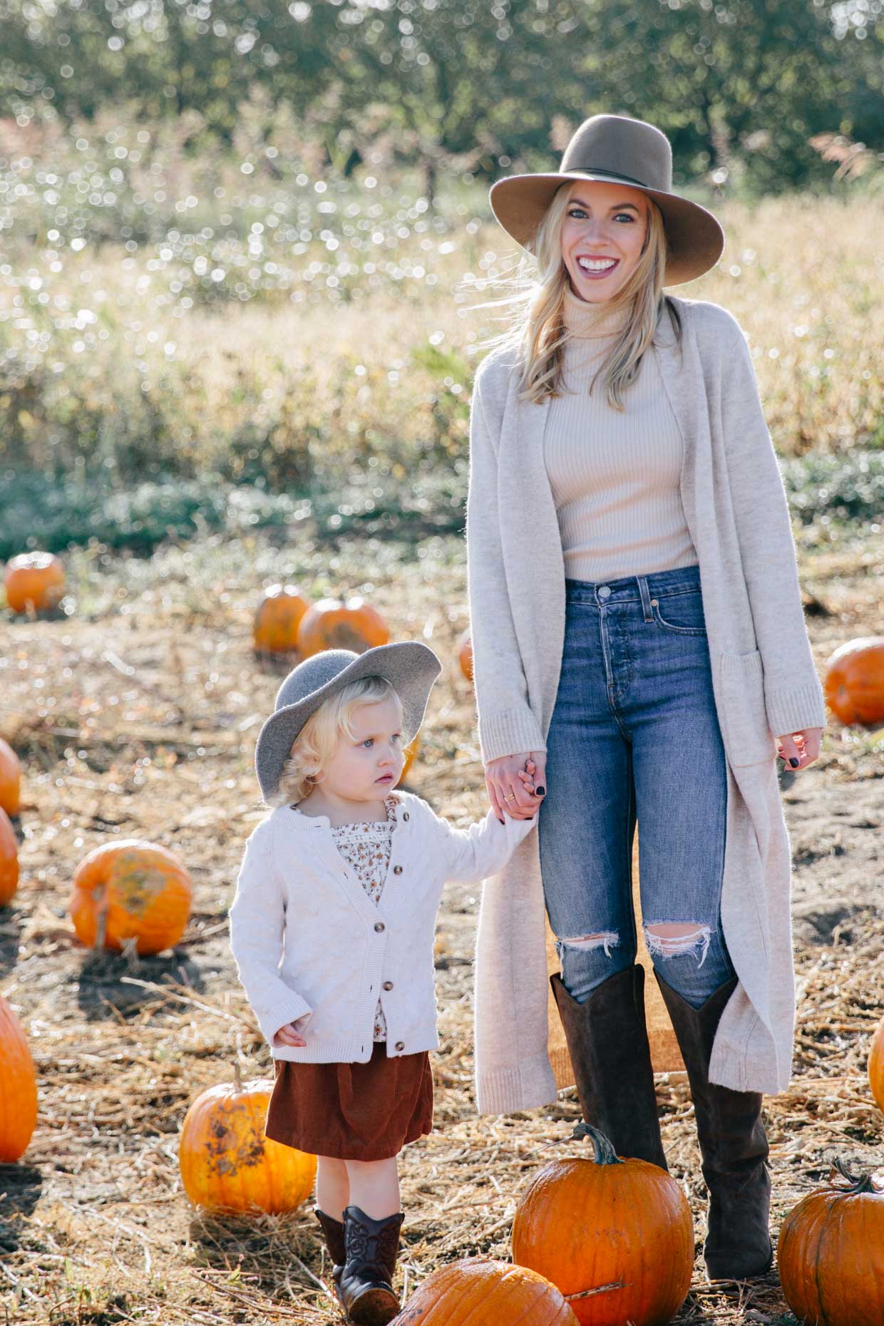 Meagan Brandon fashion blogger of Meagan's Moda wears Zara long beige cardigan with beige turtleneck and skinny jeans at pumpkin patch