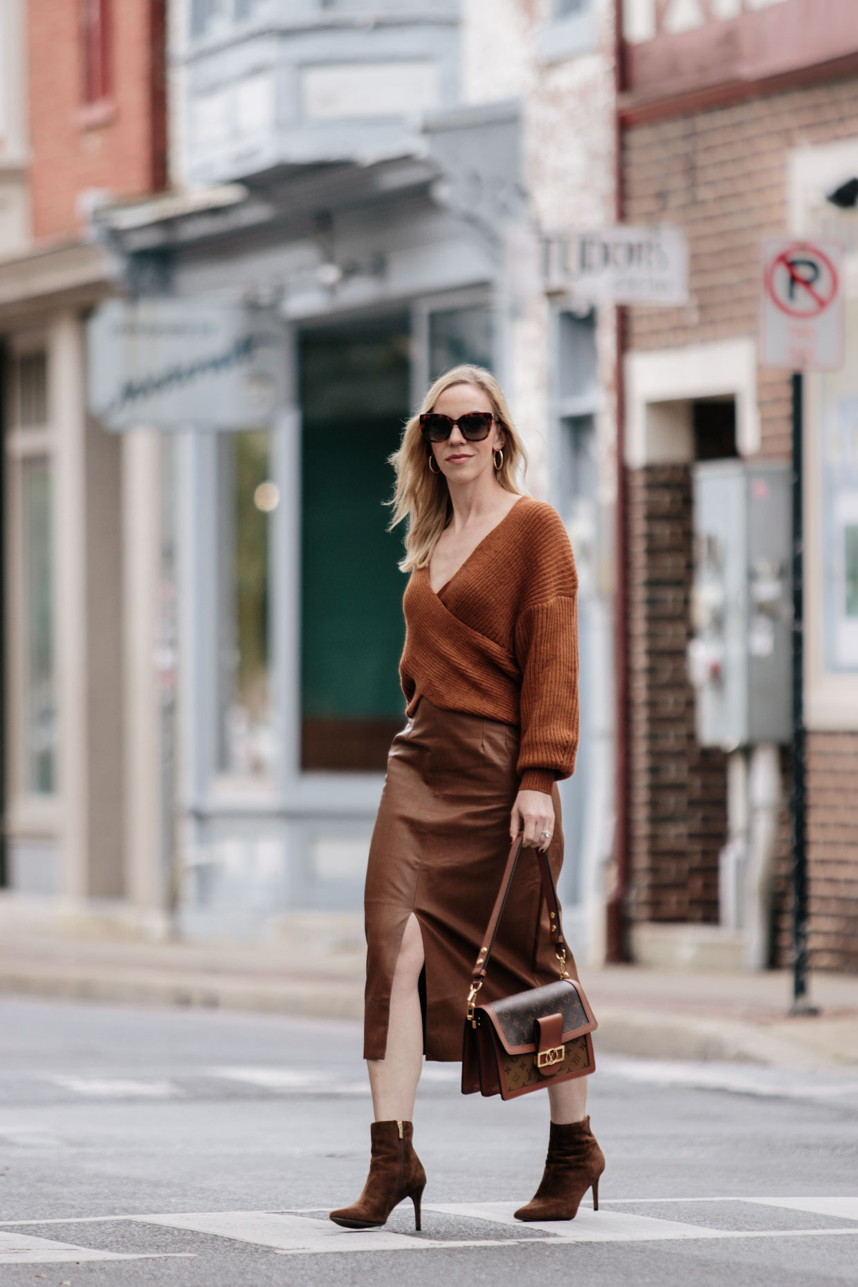 Meagan Brandon fashion blogger of Meagan's Moda wears brown faux leather  pants with Louis Vuitton Dauphine - Meagan's Moda