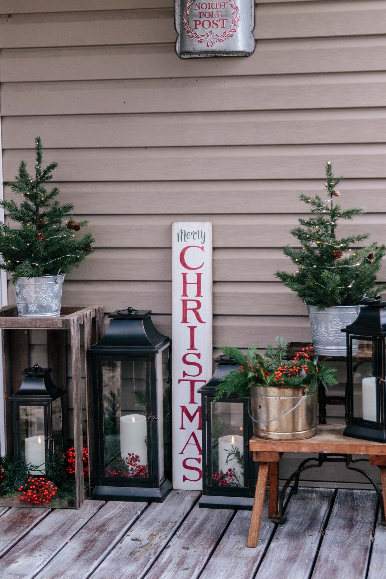 Meagan Brandon fashion lifestyle blogger of Meagan's Moda shares farmhouse Christmas porch decorations