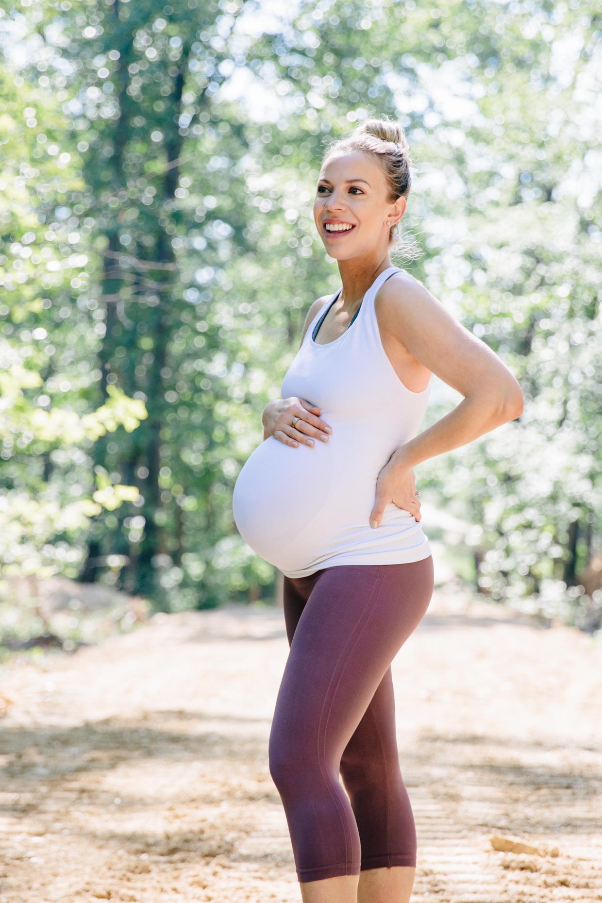 Meagan Brandon of Meagan's Moda wears BLANQI crossback maternity tank with  fawn cropped leggings, best maternity activewear - Meagan's Moda