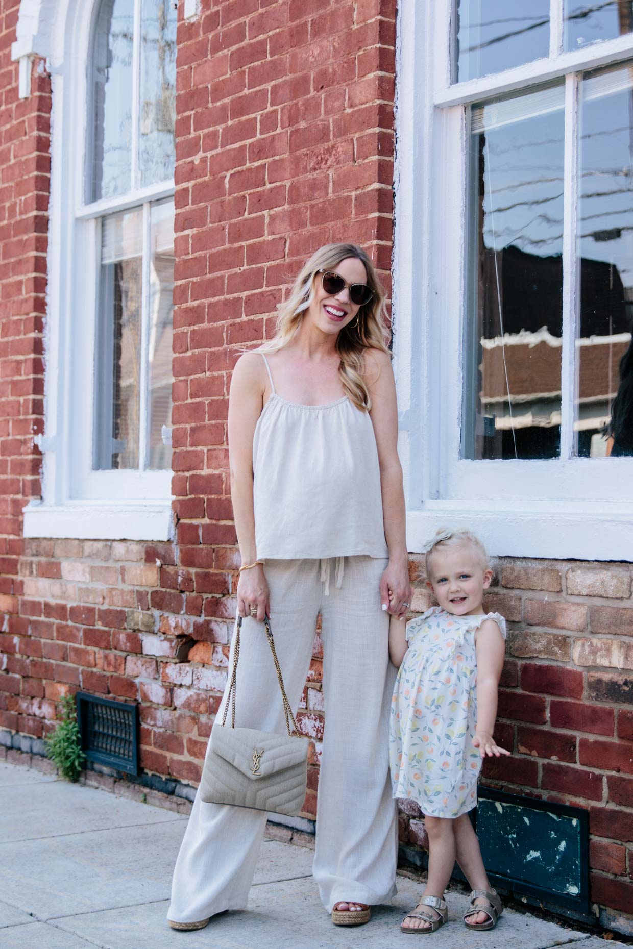 Meagan Brandon of Meagan's Moda wears linen monochrome outfit with Pink Blush linen wide leg pants and linen YSL Loulou bag