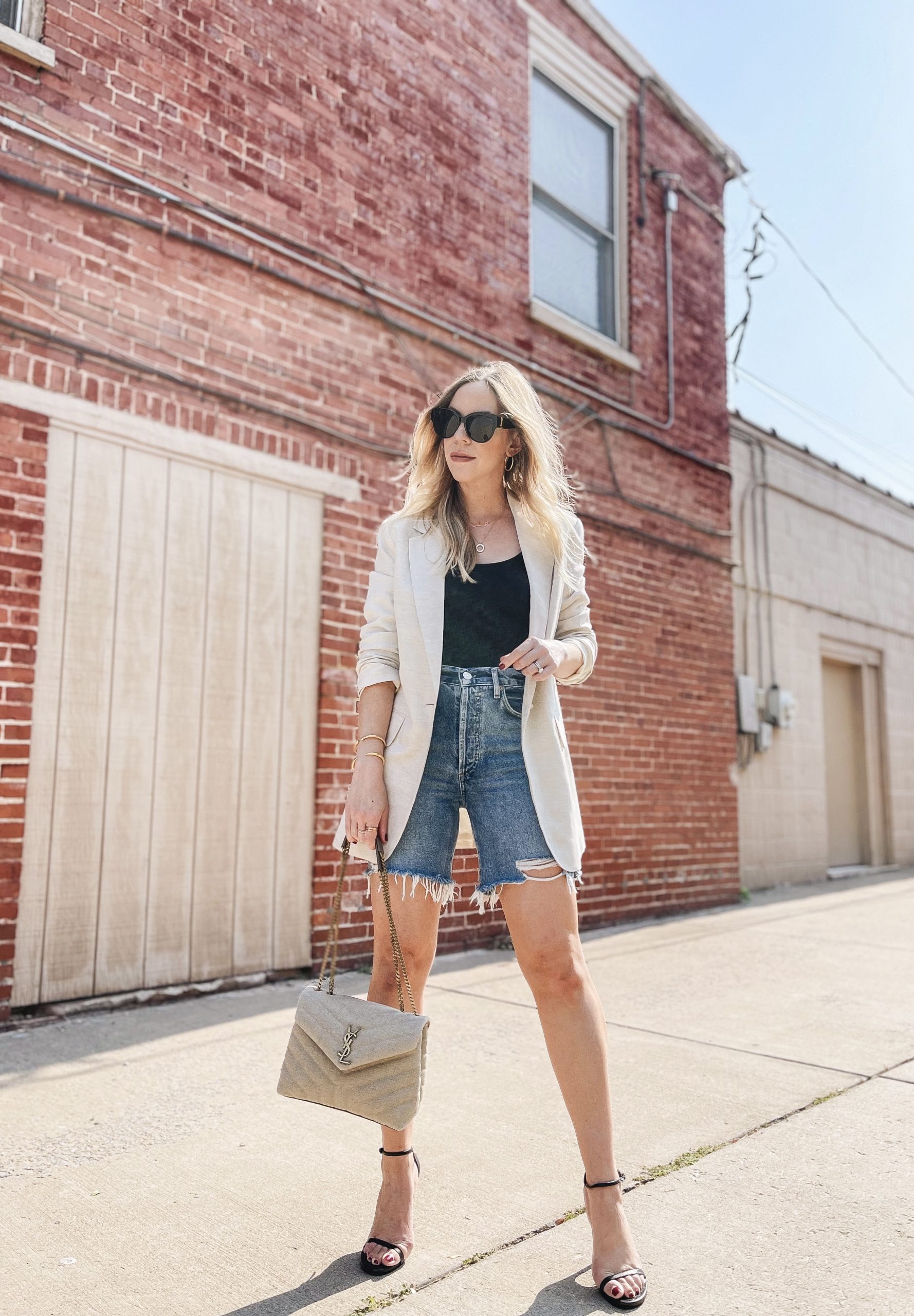 Style Black Shorts With a Bodysuit, Oversize Blazer, and Strappy