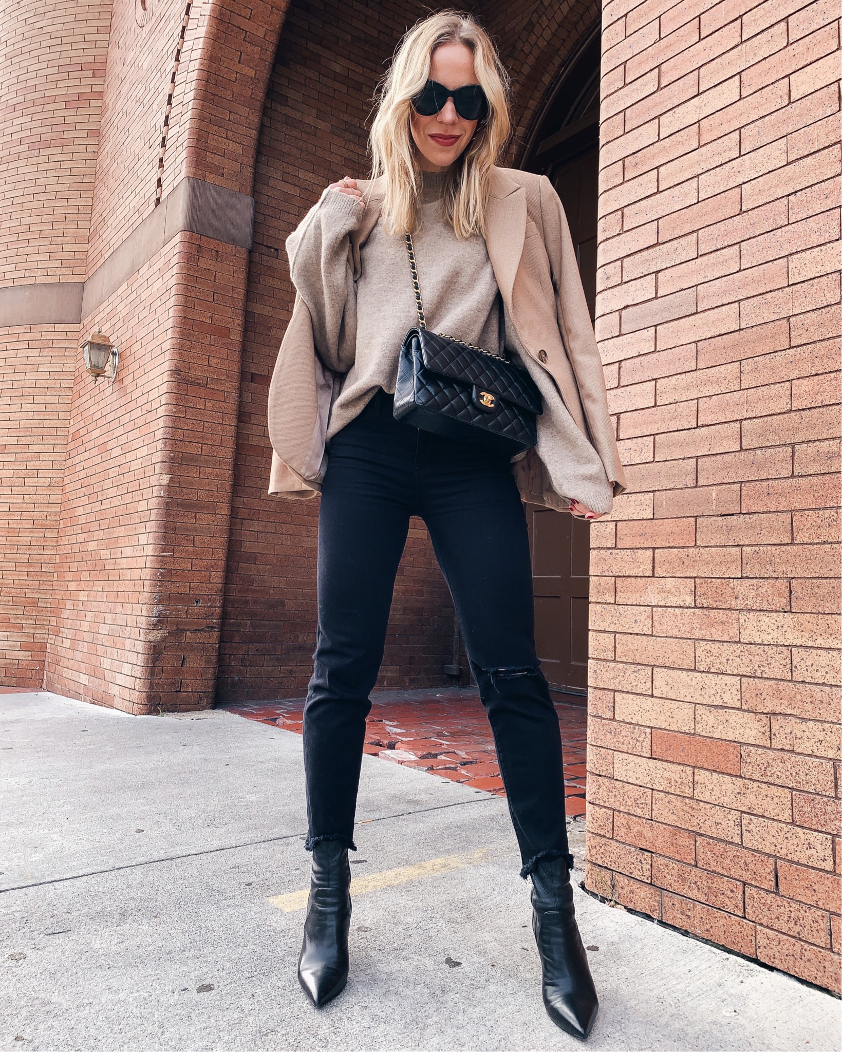 Meagan Brandon fashion blogger of Meagan's Moda wears brown faux leather  pants with Louis Vuitton Dauphine - Meagan's Moda