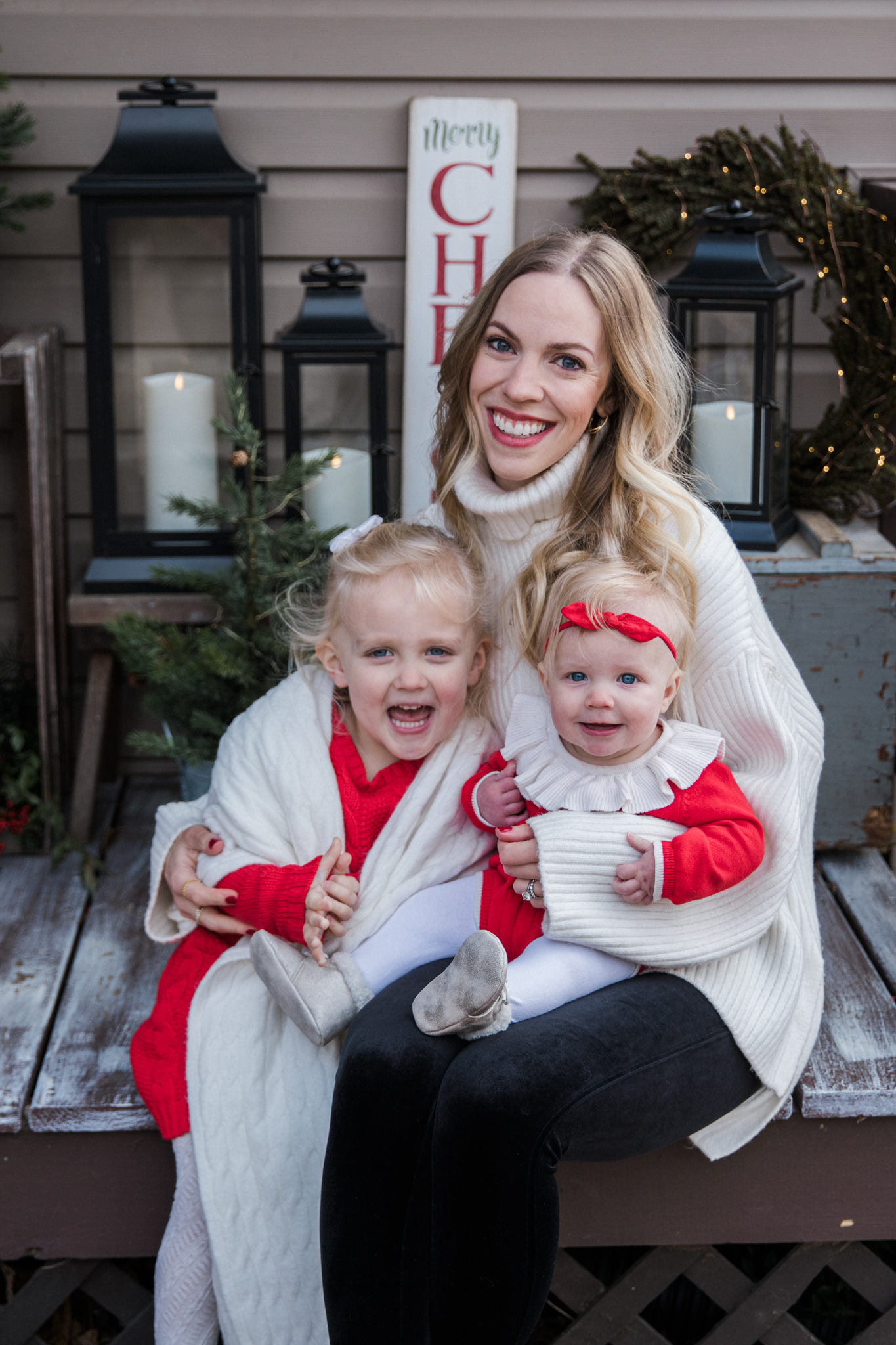 Meagan Brandon of Meagan's Moda Christmas outfits with toddler and baby girl, Christmas outfit ideas for family photos