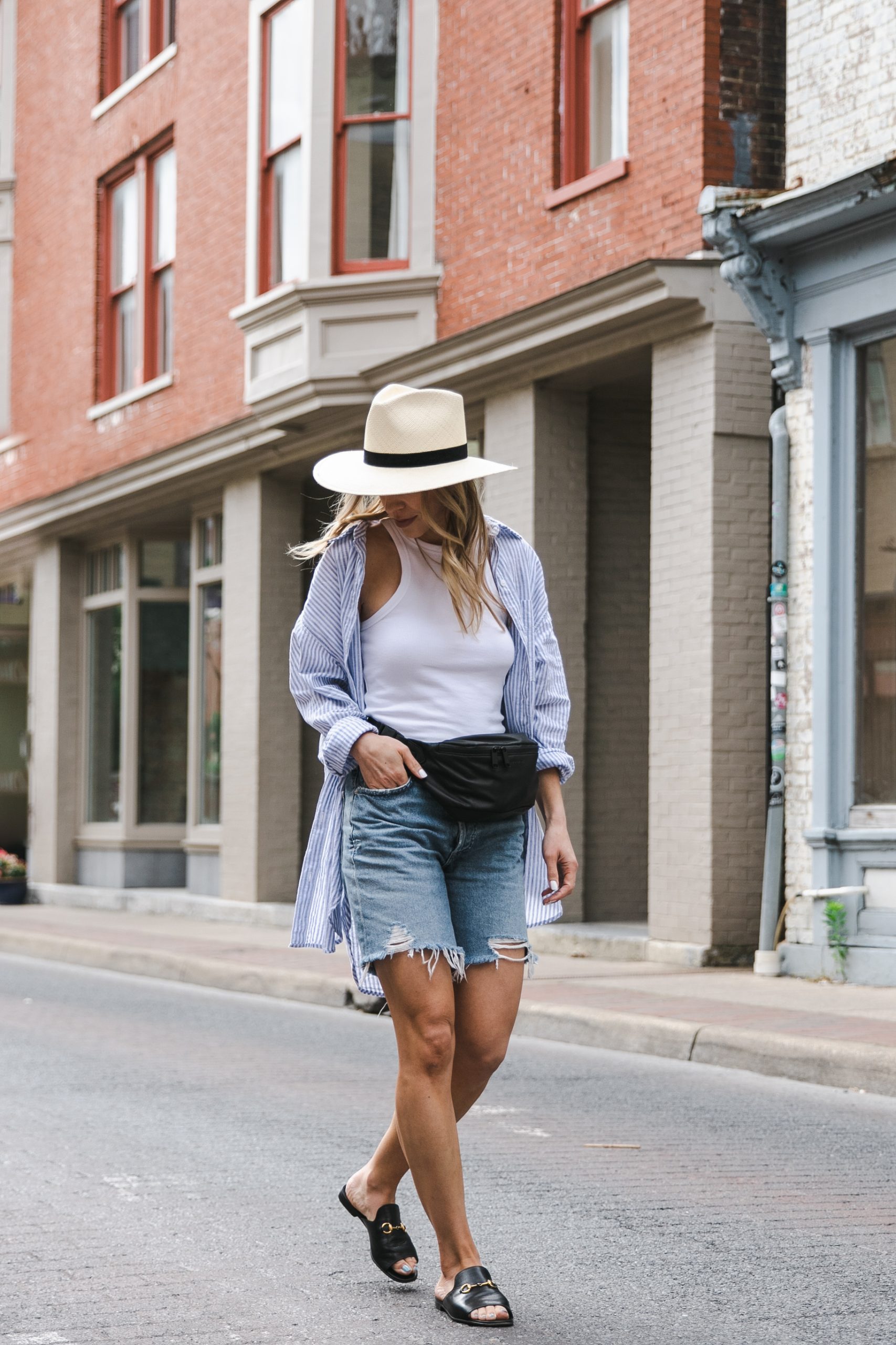 Meagan Brandon fashion blogger of Meagan's Moda wears blue and white  striped shirt with olive paperbag waist shorts and Gucci bag - Meagan's Moda