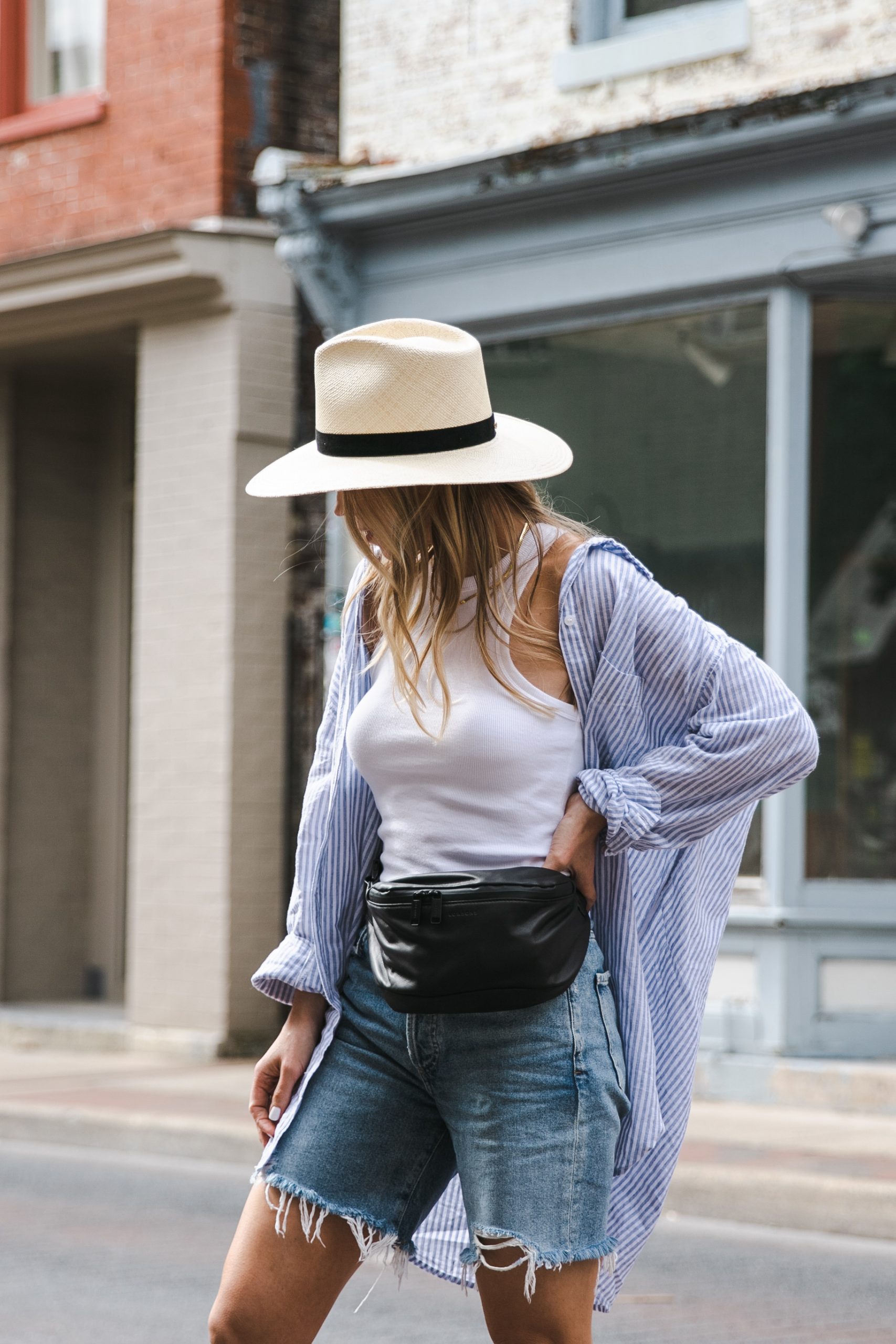 Meagan Brandon fashion blogger of Meagan's Moda wears blue and white  striped shirt with olive paperbag waist shorts and Gucci bag - Meagan's Moda